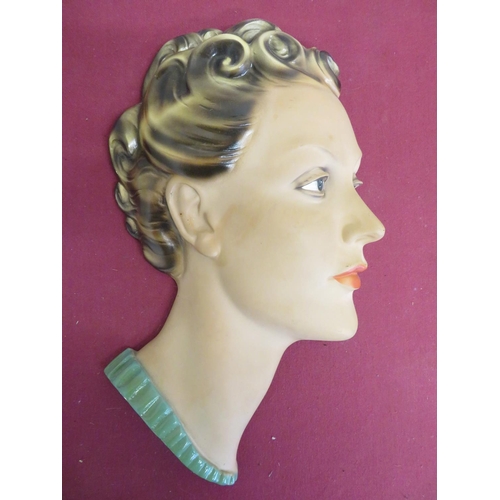 5 - Art Deco relief bust of a lady with curled hair and red lipstick and a green Art Deco style wall clo... 