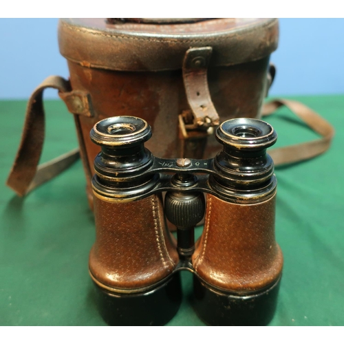10 - Cased pair of leather bound binoculars the case marked with binocular prismatic No6 case Mk1 with va... 