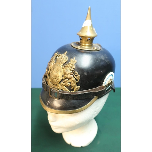 2 - WWI Prussian leather bodied pickelhaube helmet with raised brass spike and central crest badge with ... 