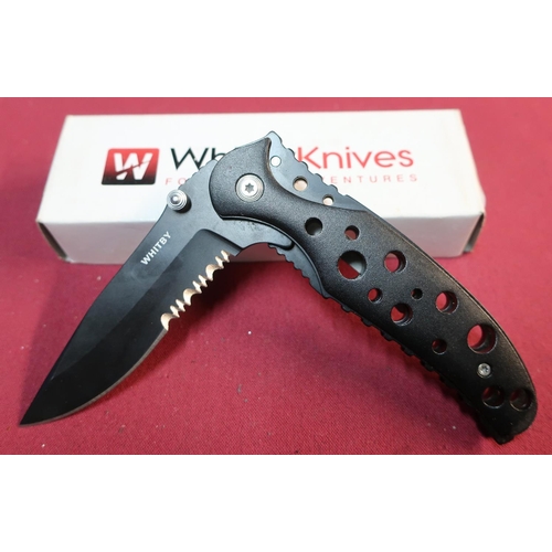 233 - Boxed as new Whitby Knives folding knife with 3 inch black blade and black pierced handle