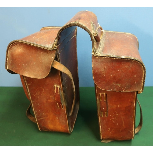 143 - Pair of German c.WWI leather saddle bags, with various stamped numbers