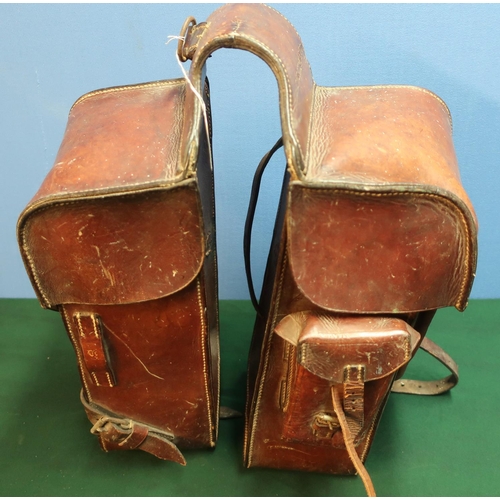 143 - Pair of German c.WWI leather saddle bags, with various stamped numbers