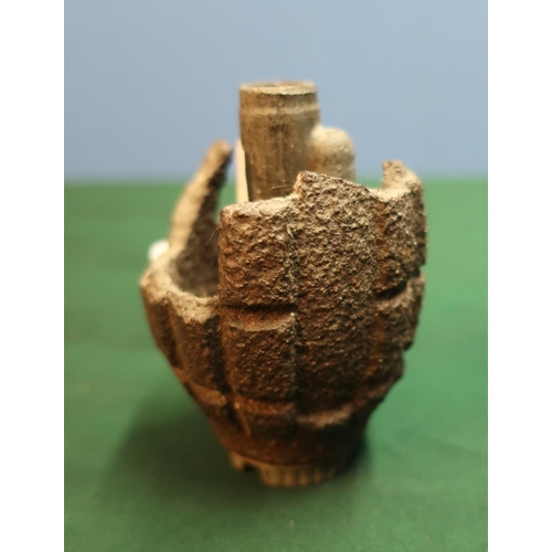 161 - Fragmented half section of a Mills hand grenade, complete with alloy base plug