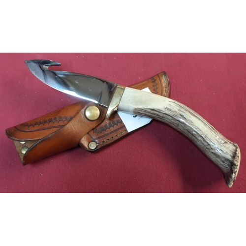 84 - Silver Stag gutting knife with 4 inch blade, antler horn grip with brass cross piece and tan leather... 