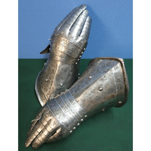 80 - Pair of Italian articulated steel gauntlets with leather backing to the fingers