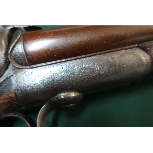 183 - Leather cased Thomas Boss & Co 14 bore hammer gun with 28 inch Damascus barrels with engraved top ri... 