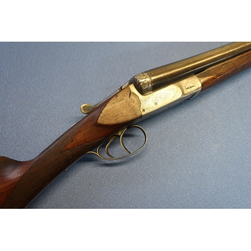 635 - Belgium 12B bar in action side by side shotgun, with 30 inch barrels with gilt scroll inlaid detail,... 