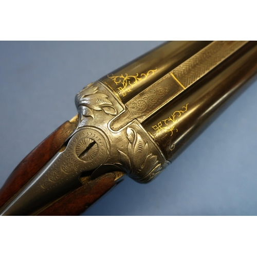 635 - Belgium 12B bar in action side by side shotgun, with 30 inch barrels with gilt scroll inlaid detail,... 