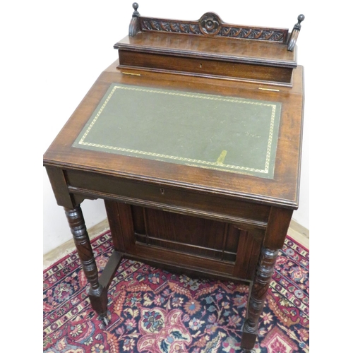 105 - Victorian mahogany davenport with raised lift up top section with carved detail, revealing fitted in... 