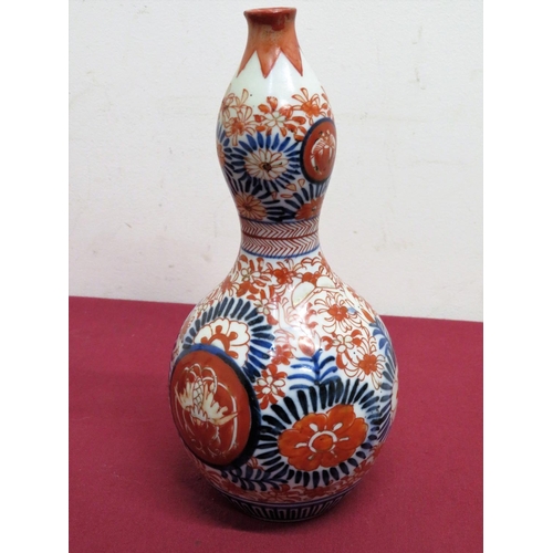 12 - A pair of Japanese Imari pattern mallet shaped vases (H18cm), similar double gourd shaped vase. (H22... 