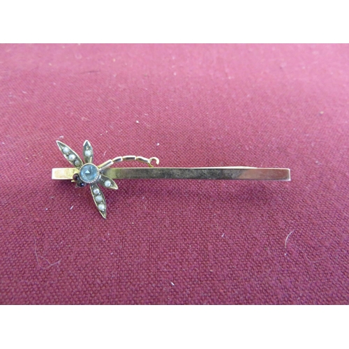 19 - 9ct gold bar brooch, set with a dragonfly with seed pearl wings and garnet eyes, stamped 9ct, 3.0g