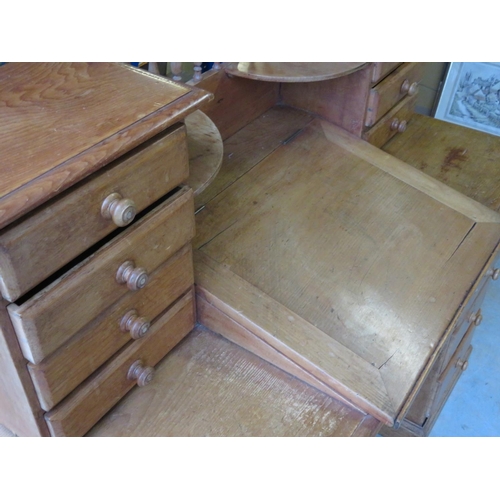 231 - Pine twin pedestal clerks type desk, raised back with sloped writing surface above three frieze and ... 