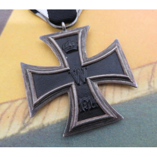 139 - WWI German Iron Cross, on ribbon and a reproduction German poster (2)