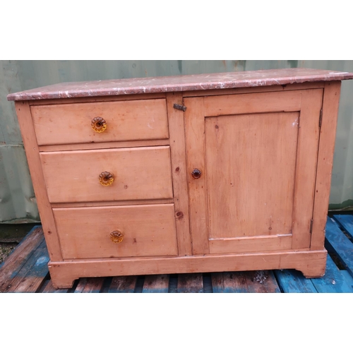 99 - Victorian waxed pine marble top wash stand with single panel cupboard door flanked by three drawers ... 