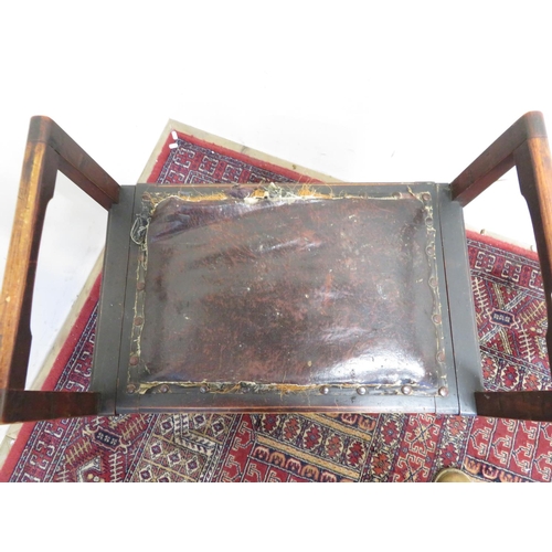 169 - Art nouveau style ebonised piano stool with raised side arms and lift up seat, on square supports