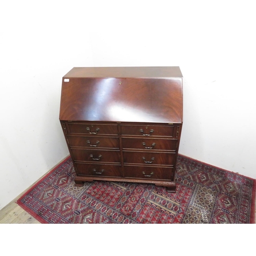 178 - Modern mahogany bureau with full front above two drawers and two faux drawer cupboard doors on raise... 