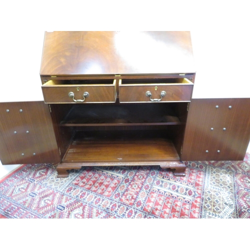 178 - Modern mahogany bureau with full front above two drawers and two faux drawer cupboard doors on raise... 