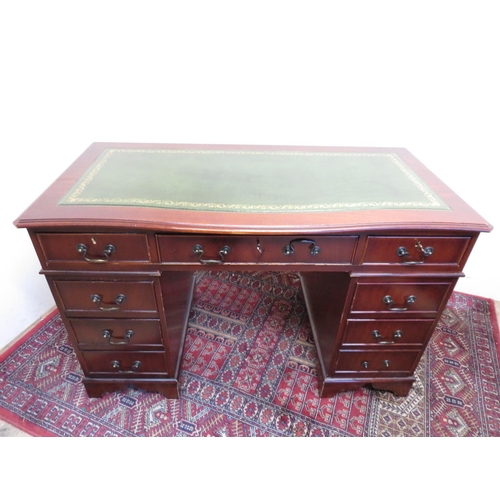 185 - Modern mahogany reproduction desk with green inset top and central drawer W122cm D61cm H77cm
