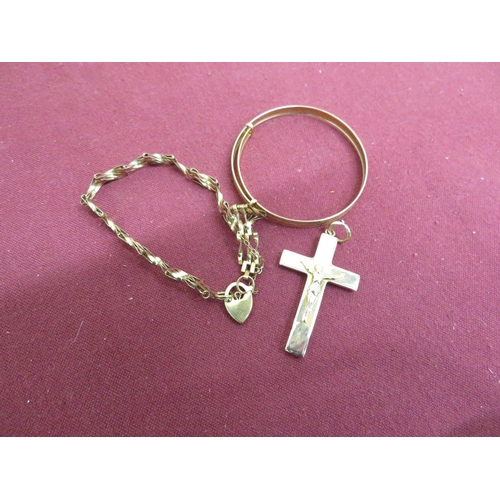 32 - 9ct hallmarked gold crucifix and gate bracelet, and another bracelet stamped 375, 6.5g (3)