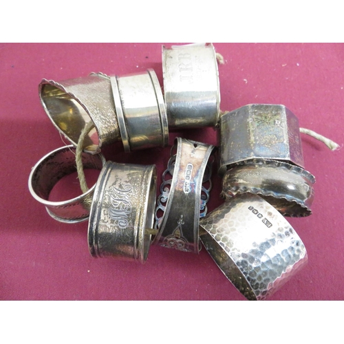 25 - Collection of nine Victorian and later hallmarked silver napkin rings, variously decorated, Birmingh... 