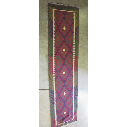 330 - Kelim runner of multicoloured design (300cm x 80cm)