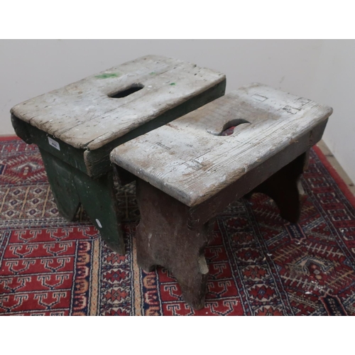 409 - Two rustic stools, rectangular tops pierced with hand grip, W48cm x H35cm x D27cm max. (2)