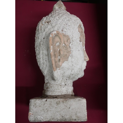 427 - Pottery model of a Tibetan deity head, with remnants of white finish, on a rectangular base, H43cm