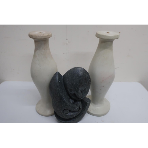 485 - Grey carved soapstone model of two entwined faces and a pair of polished soapstone type table lamp b... 