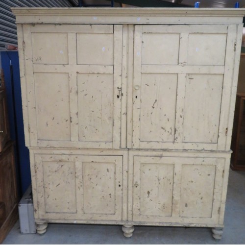 410 - Large Victorian pine housekeepers cupboard with moulded cornice enclosed by four four panelled doors... 