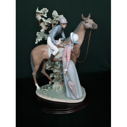 76 - Lladro figurine 5036 “Jockey With Lass” H40cm, including base.