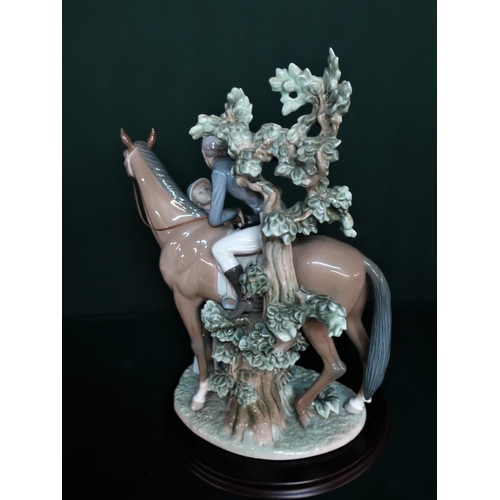 76 - Lladro figurine 5036 “Jockey With Lass” H40cm, including base.