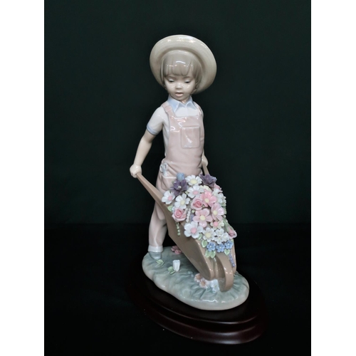 82 - Lladro figurine 1283 Wheelbarrow with Flowers Boy. H25cm, including base.