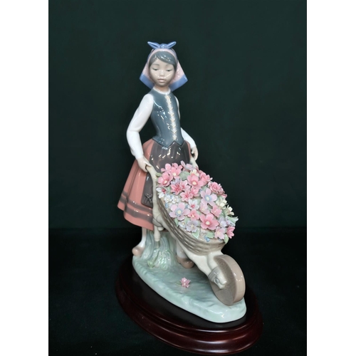 85 - Lladro figurine 1419 “Barrow Of Blossoms” H25cm, including base.