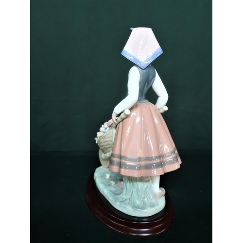 85 - Lladro figurine 1419 “Barrow Of Blossoms” H25cm, including base.