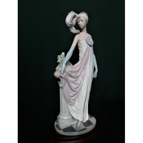 103 - Lladro figurine 5283 “Dama Charleston” in original box. H37cm, including base.