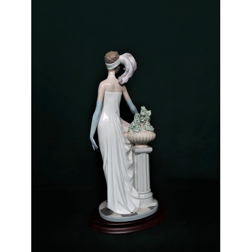 103 - Lladro figurine 5283 “Dama Charleston” in original box. H37cm, including base.