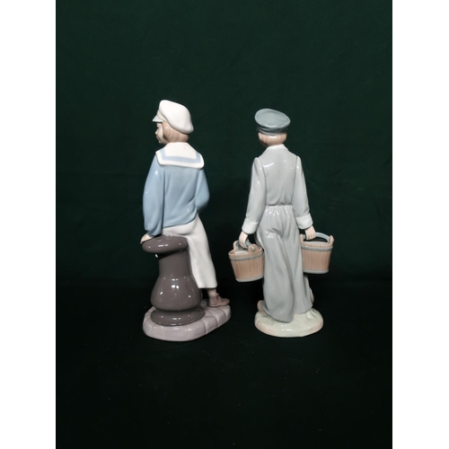 115 - Lladro figurine 4810 Boy With Yacht, H22cm and Lladro figurine 4811 Boy With Pails, H22cm.