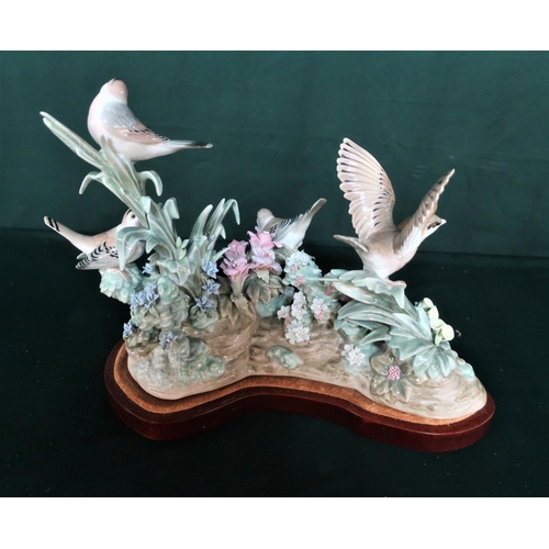 69 - Lladro figurine Bird Group, in original box including base - Four brown birds resting amongst pink, ... 