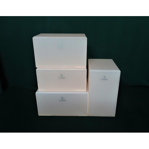 96 - Set of four Lladro opaque pink plastic display blocks H12cm D16cm L22cm (2) H12cm D12cm L20cm (2).