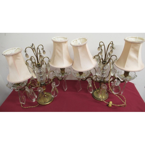 26 - Pair of 20th C continental gilt metal two branch table lamps, hung with faceted drops H34cm (2)
