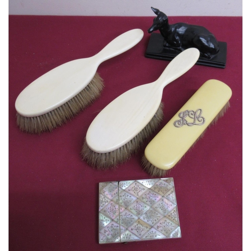 29 - Victorian mother of pearl card case, pair of ivory hairbrushes, ivorine hairbrush, and a resin model... 