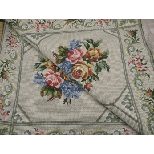 46 - 20th C woolwork rug, light green ground with rose pattern centre and scrolling floral pattern border... 