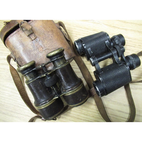 57 - Early 20th C Galilean binoculars, brass body with leather trim and pull out objective lens hoods, in... 