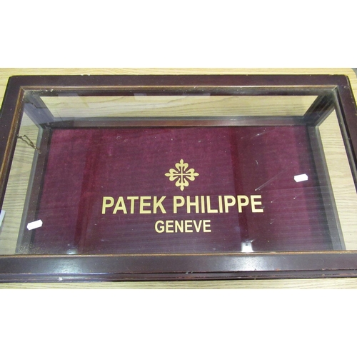 69 - Mahogany table-top glazed display cabinet with hinged lid with later applied Patek Philippe decorati... 