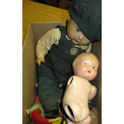 263 - Composition doll with opening eyes and jointed limbs, in green school uniform (H48cm), another baby ... 