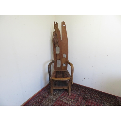 398 - Rustic wooden made throne type chair with pierced high back and down scrolled arms, with solid seat ... 