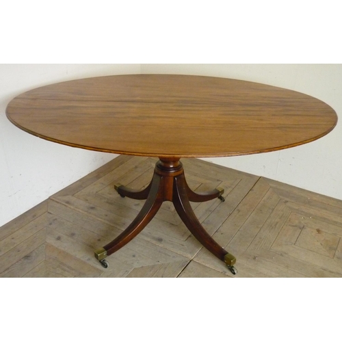 406 - Early 19th C mahogany oval breakfast table, tilt top on vase turned column with four out-splayed sup... 