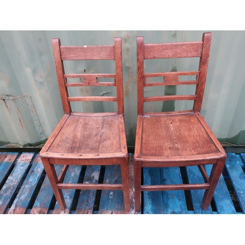 433 - Set of four 19th C elm ladder back dining chairs with solid seats on square supports (4)