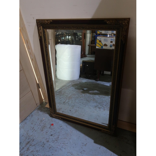 264 - Rectangular bevelled edge wall mirror in gilt and moulded frame W108cm H77cm