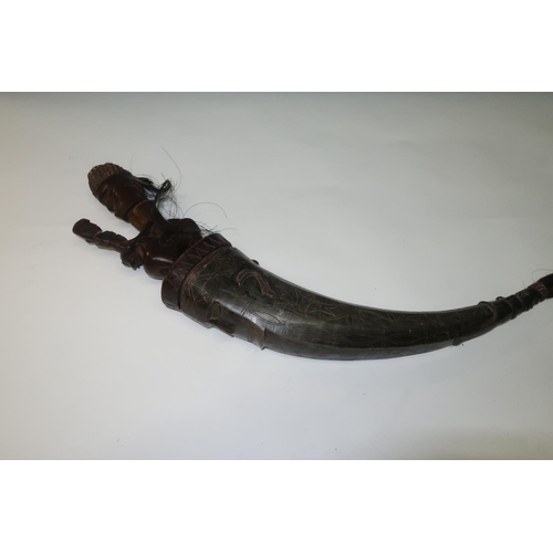 139 - Late 19th C carved Batak Sumatran  tribal horn flask, the horn with engraved detail with carved figu... 